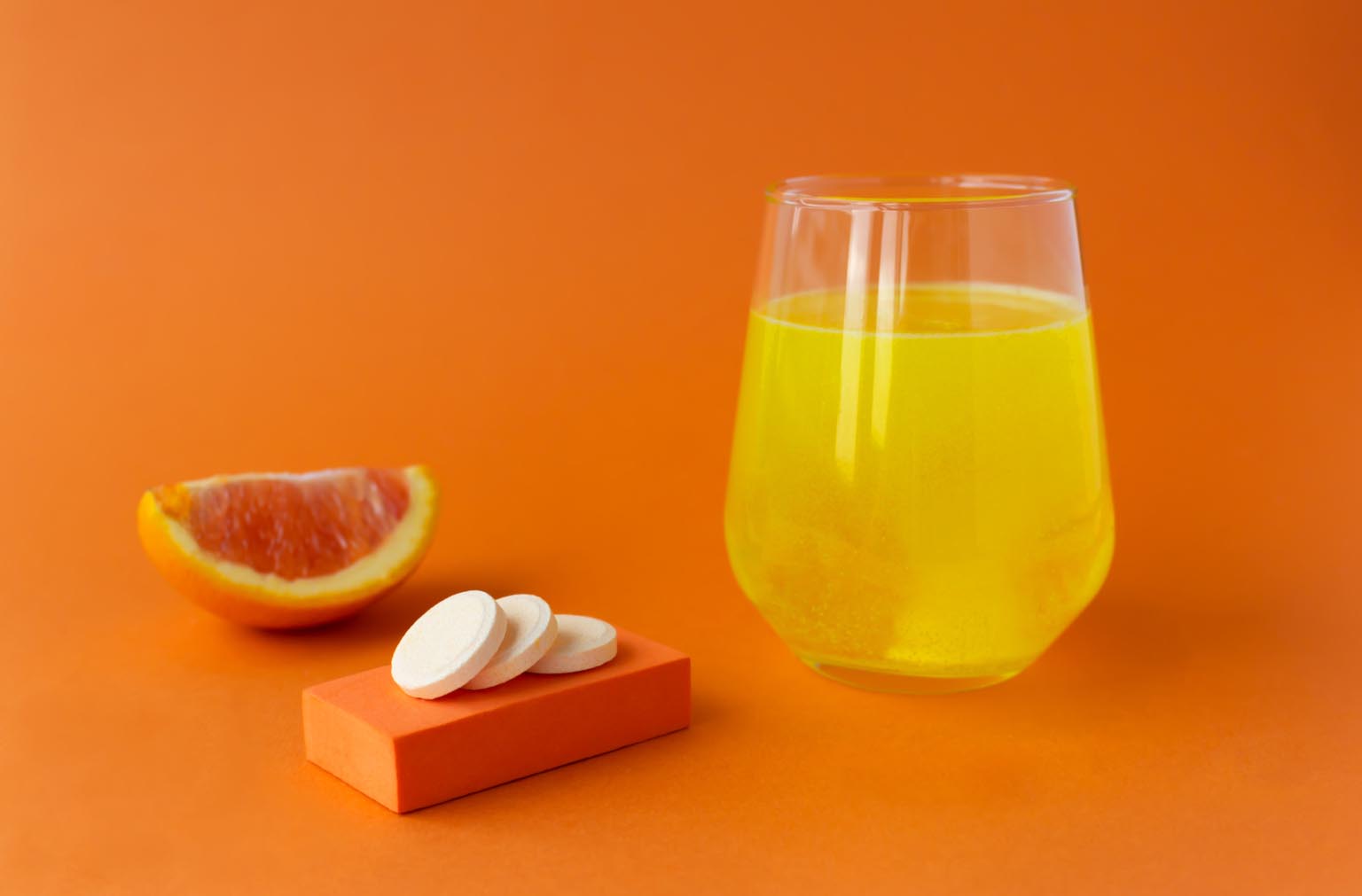 Vitamin C effervescent tablet, water soluble with orange flavor. X115®
